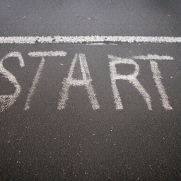 The word "START" written on a street surface