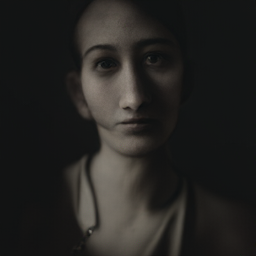 A woman in a minimalistic studio portrait